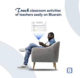 A man sitting on a chair, cross legged, and checking his phone .; Bluerain School Management Software